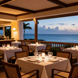 Caribbean Holidays, February Escapes, Elegant adults-only hotel restaurant in Puerto Rico serving Caribbean-inspired dinner, warm evening lighting and relaxed tables