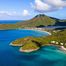 Caribbean Holidays, February Honeymoons, Aerial view of the British Virgin Islands showing Tortola, green hills, sheltered bays and clear Caribbean water under a sunny sky
