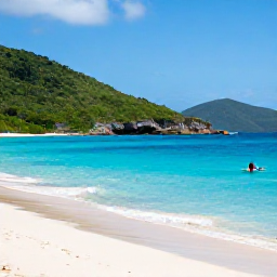 Caribbean Holidays, February Instagram Hotspots, White sand beach and vivid blue sea at Trunk Bay on St John, United States Virgin Islands, with green hills and a snorkeller in the water