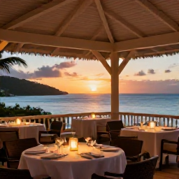 Caribbean Holidays, February Luxury, Elegant open-air restaurant beside the Caribbean Sea in the British Virgin Islands, with candlelit tables and a February sunset