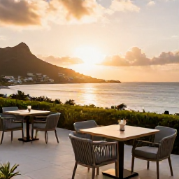 Caribbean Holidays, February Luxury Holidays, An elegant luxury hotel terrace overlooking a calm Caribbean bay at sunset on Saint Martin, with stylish outdoor dining and soft golden light