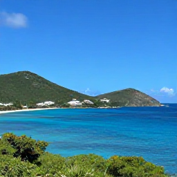 Caribbean Holidays, February Nature Holidays, Panoramic coastal view of Saint Martin and Sint Maarten in February, bright blue Caribbean water, green hills and a clear sunny sky