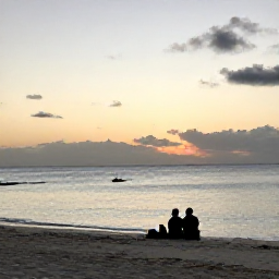 Caribbean Holidays, February Tours, Relaxed evening on a Turks and Caicos beach with soft sunset light, calm sea and travellers enjoying a peaceful February holiday