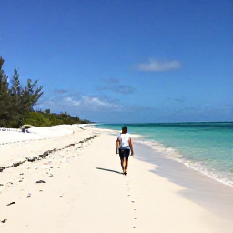 Caribbean Holidays, February Walking, A walker on a quiet white-sand beach in Turks and Caicos beneath a clear February sky