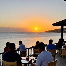 Caribbean Holidays, February Wellness, Peaceful Caribbean sunset viewed from a waterfront restaurant in St Croix, US Virgin Islands, relaxed diners, warm evening light and calm sea