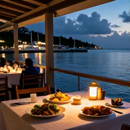 Caribbean Holidays, Grenada Adventure Holidays, A relaxed evening at a waterfront restaurant in Grenada, with local food, warm lights and the harbour beyond