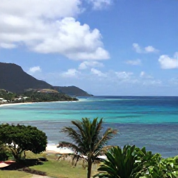 Caribbean Holidays, Grenada Adventure Holidays, A scenic coastal view of Grenada in April, with turquoise sea, green hills and a small sailing boat