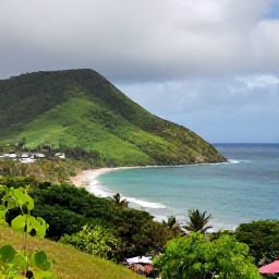Caribbean Holidays, Grenada August Breaks, Tropical Grenadian coastline with light rain clearing over green hills and the Caribbean Sea