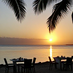 Caribbean Holidays, Grenada Beach Holidays, Relaxed beachfront restaurant in Grenada at sunset, serving Caribbean food with tables overlooking calm sea and palm silhouettes