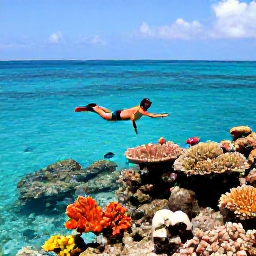 Caribbean Holidays, Grenada Beach Holidays, Traveller snorkelling in clear shallow water beside a colourful coral reef in Grenada, tropical fish visible below