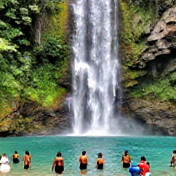 Caribbean Holidays, Grenada in February, Annandale Falls in Grenada with a clear pool, tropical vegetation and visitors enjoying the natural waterfall
