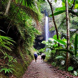 Caribbean Holidays, Grenada in September, A lush Grenadian rainforest trail with a waterfall, tropical plants and visitors walking through the Grand Etang area in September