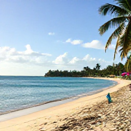 Caribbean Holidays, Grenada Instagram Hotspots, A bright September morning view of Grand Anse Beach in Grenada, with calm turquoise water, soft sand, palm trees and a few colourful beach umbrellas