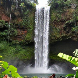 Caribbean Holidays, Grenada Instagram Spots, Annandale Falls in Grenada surrounded by lush tropical forest, falling water, visitors and vivid green foliage