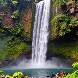 Caribbean Holidays, Grenada Instagram Spots, Annandale Falls in Grenada surrounded by lush tropical rainforest, falling water, ferns and a natural pool with visitors nearby