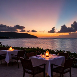 Caribbean Holidays, Grenada Wellness, Relaxed evening in Grenada overlooking the Caribbean Sea, sunset colours, outdoor dining and soft lantern light