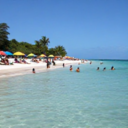 Caribbean Holidays, Guadeloupe Beaches, Travellers swimming and relaxing on Sainte-Anne beach in Guadeloupe, with clear shallow water, white sand and colourful umbrellas