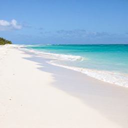 Caribbean Holidays, Guadeloupe February, A wide, peaceful Guadeloupe beach with white sand, turquoise sea and soft February sunshine