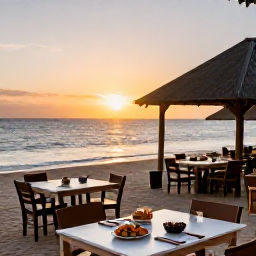 Caribbean Holidays, Guadeloupe February, Outdoor tables at a small Guadeloupe beach restaurant serving fresh seafood at sunset