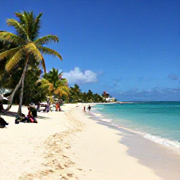Caribbean Holidays, Guadeloupe in May, Grande-Terre beach in Guadeloupe with white sand, clear blue water, palm trees and visitors enjoying a sunny May day