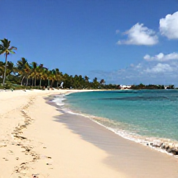 Caribbean Holidays, Guadeloupe November, A bright Caribbean beach near Sainte-Anne, Guadeloupe, with turquoise water, soft sand, palm trees and a calm November sky