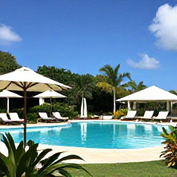 Caribbean Holidays, Guadeloupe Spa Breaks, Luxury Guadeloupe spa resort with an outdoor pool, loungers, tropical plants and bright Caribbean sunshine