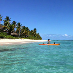 Caribbean Holidays, Haiti Adventure, Kayaker paddling along clear Caribbean water beside a quiet Haitian coastline