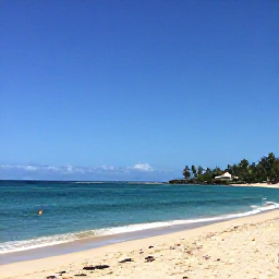 Caribbean Holidays, Haiti City Breaks, Calm turquoise Caribbean sea and a sandy Haitian beach near Port-au-Prince under a clear blue sky