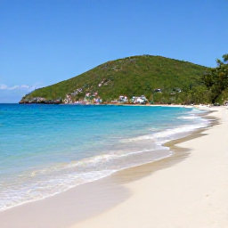 Caribbean Holidays, Haiti in February, A sunny Haitian coastline in February with turquoise water, a quiet sandy beach and green hills beyond