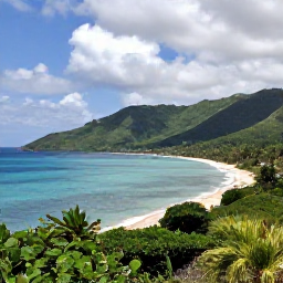 Caribbean Holidays, Haiti May Holidays, Haitian coastal landscape with turquoise sea, sandy beach and green hills under a partly cloudy May sky