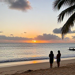 Caribbean Holidays, Haiti October Holidays, A couple watching the sunset from a quiet Haitian beach after an October day, with warm evening light over the Caribbean Sea