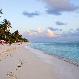 Caribbean Holidays, Haiti Tours, Haitian coastline with calm turquoise sea, sandy beach and travellers enjoying a relaxed February afternoon