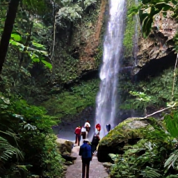 Caribbean Holidays, Jamaica April Tours, Jamaican waterfall surrounded by lush green forest, with visitors walking on a safe path beneath the falls