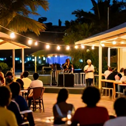 Caribbean Holidays, Jamaica City Breaks, Jamaica city break evening with live reggae music, warm street lights and visitors enjoying a relaxed outdoor venue