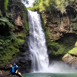 Caribbean Holidays, Jamaica December Tours, Dunn's River Falls in Jamaica with visitors climbing the limestone cascades through lush tropical forest