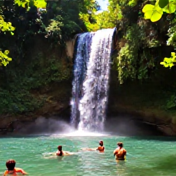 Caribbean Holidays, Jamaica in April, Jamaican waterfall cascading into a clear natural pool, surrounded by tropical forest and visitors swimming in April sunshine
