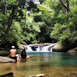 Caribbean Holidays, Jamaica in May, Visitors hiking through lush Jamaican rainforest beside a clear river and small waterfall