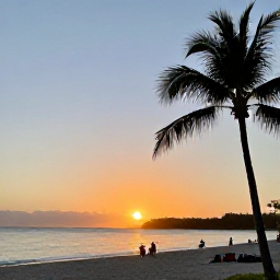 Caribbean Holidays, Jamaica June Tours, Relaxed sunset scene on Seven Mile Beach in Negril with palm trees, calm sea and visitors walking along the sand