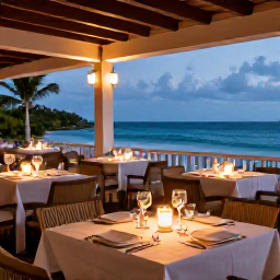 Caribbean Holidays, January Adults Only, Elegant adults-only resort restaurant serving Caribbean and international dishes on a candlelit terrace overlooking the sea