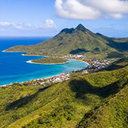 Caribbean Holidays, January Adventures, Aerial view of Saint Vincent and the Grenadines, showing lush green mountains, turquoise sea and scattered islands in bright January sunshine