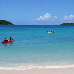 Caribbean Holidays, January Adventures, Kayakers and snorkellers in clear turquoise water between Saint Kitts and Nevis, with tropical fish and a sandy beach