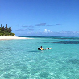 Caribbean Holidays, January Backpacking, Backpacker swimming and snorkelling in clear turquoise water beside a quiet Bahamian island beach