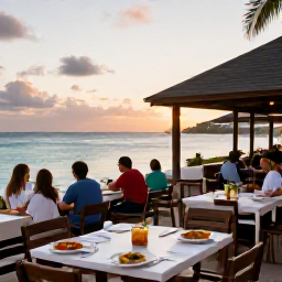 Caribbean Holidays, January Beaches, An outdoor Caribbean restaurant beside the sea in St Thomas at sunset, with fresh local food and relaxed diners
