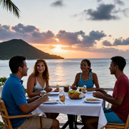 Caribbean Holidays, January Cooking Holidays, Travellers enjoying a relaxed Caribbean cooking holiday dinner on a terrace at sunset in the United States Virgin Islands