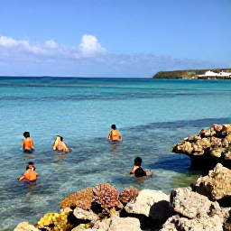 Caribbean Holidays, January Cura&ccedil;ao Holidays, Snorkellers exploring clear shallow water above a colourful coral reef at a Cura&ccedil;ao beach