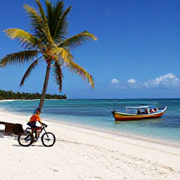 Caribbean Holidays, January Cycling Holidays, Cyclist beside a secluded white-sand beach on Bequia, with calm blue sea, palm trees and colourful wooden boats