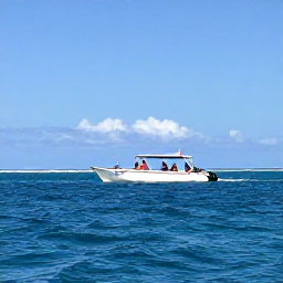 Caribbean Holidays, January Diving, Small dive boat carrying holidaymakers across calm blue Caribbean water near Cayman Brac