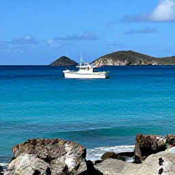Caribbean Holidays, January Fishing Cura&ccedil;ao, Sport fishing boat cruising past Cura&ccedil;ao's rugged coast, turquoise sea, sunny January weather and distant island hills