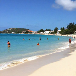 Caribbean Holidays, January Getaway, Beautiful January beach scene at Orient Bay on Saint Martin, with clear turquoise water, pale sand and visitors enjoying water sports