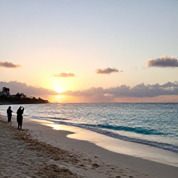 Caribbean Holidays, January Hotspots, Sunrise over Maho Beach in Sint Maarten, with a quiet sandy shoreline, turquoise sea and a few early visitors taking photographs